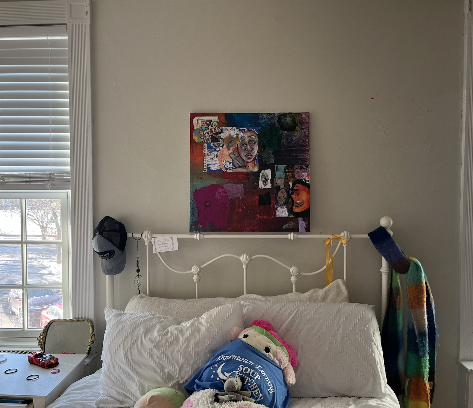 The finished piece hanging above a bed